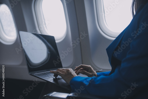 Using mobile and laptop, Thoughtful asian people female person onboard, airplane window, perfectly capture the anticipation and excitement of holiday travel. chinese, japanese people.