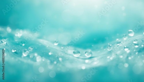 Water drops on a blue water surface with bokeh effect.