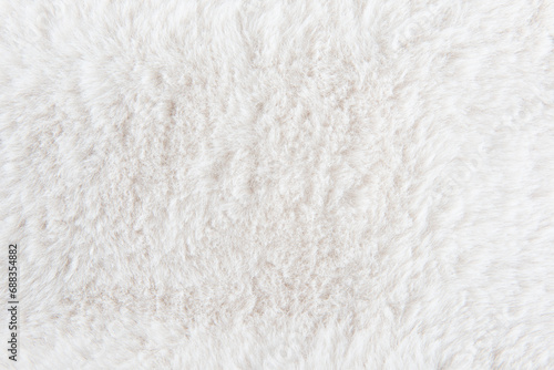 white plush fabric texture background , background pattern of soft warm material photo