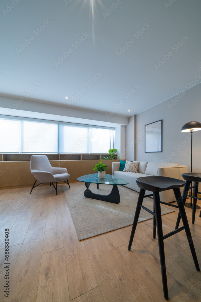 Luminous living room with parquet floor and modern furniture Luminous living room with parquet floor and modern furniture