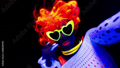 Female dancer in glow UV costume photo