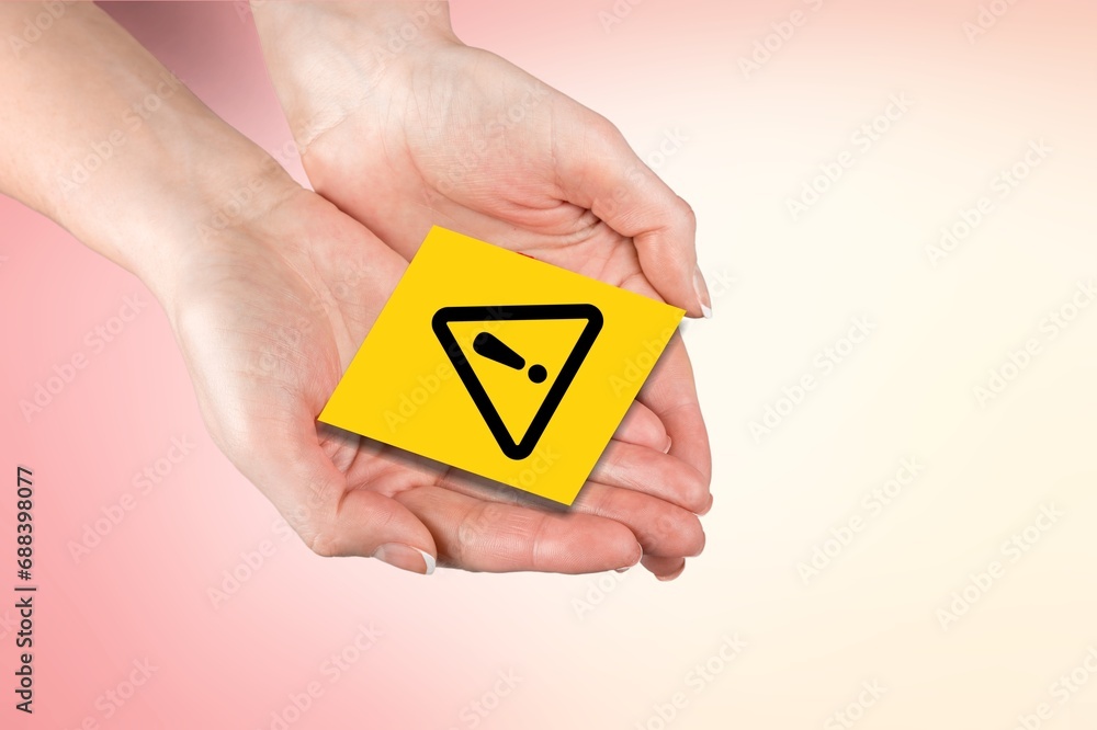 Hand holding Exclamation mark yellow Warning sign Hand holding Exclamation mark yellow Warning sign