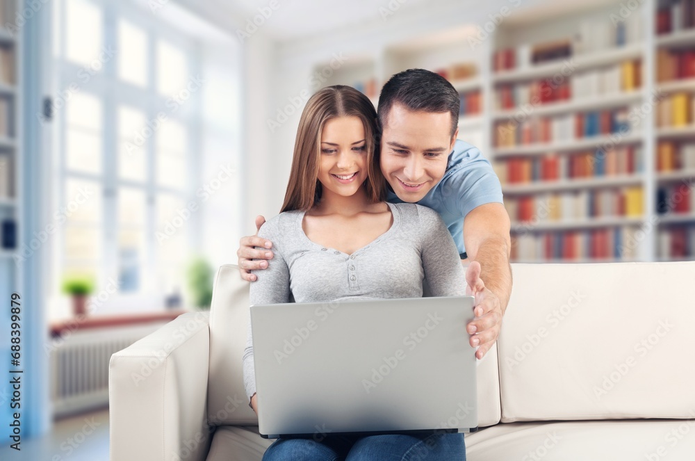 Young married happy couple using social media. Young married happy couple using social media.