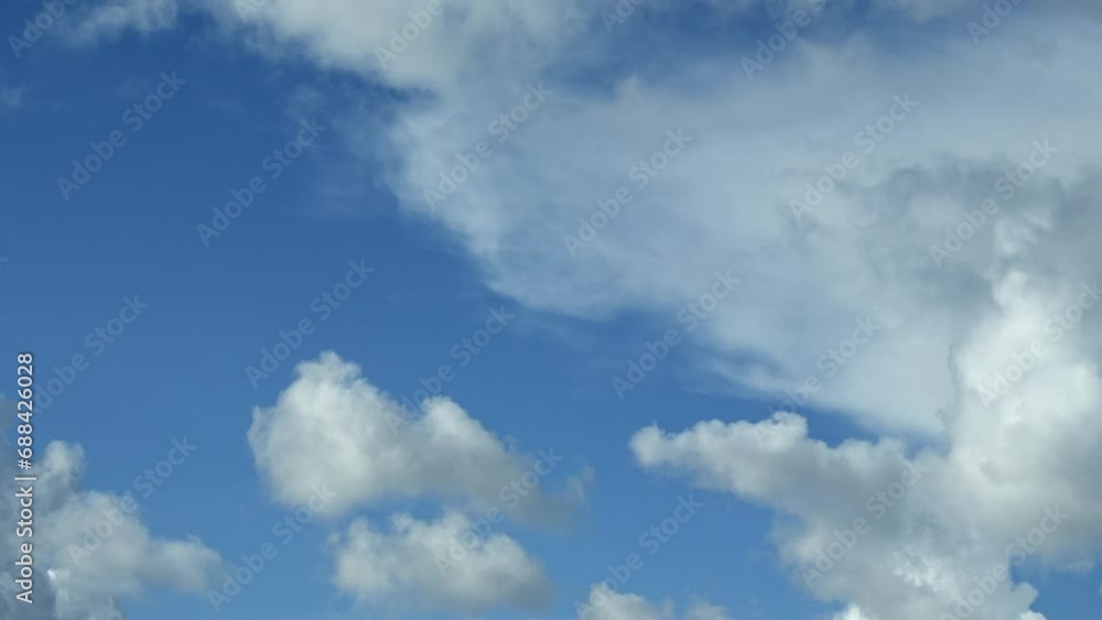 Time lapse of white clouds moving with blue patches of sky Time lapse of white clouds moving with blue patches of sky