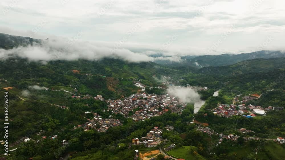 Drone shot overlooking the San Rafael village in middle of clouds of Colombia Drone shot overlooking the San Rafael village in middle of clouds of Colombia