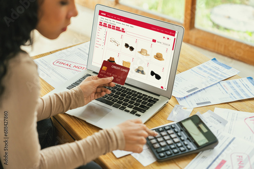 Woman shopping online on internet marketplace browsing for sale items for modern lifestyle and use credit card for online payment from wallet protected by crucial cyber security software