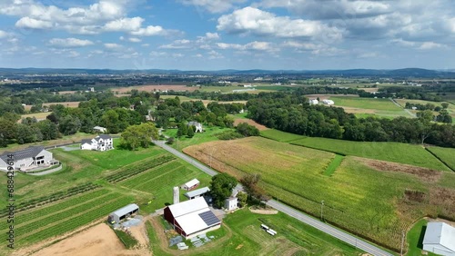 Pennsylvania farmland during bright summer day. Aerial rising reveal shot. photo