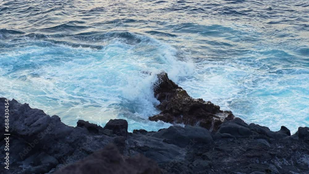 Rocks being swallowed by waves of water from the sea in Canary Island, Tenerife, static slow motion Rocks being swallowed by waves of water from the sea in Canary Island, Tenerife, static slow motion