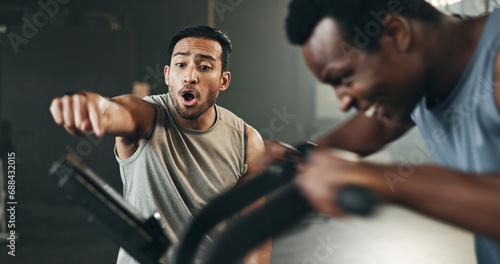 Trainer, support and man on fitness bike, motivation and cardio at gym, workout and exercise. Instructor, coach and bicycle at health club, equipment and performance or challenge, training or cycling