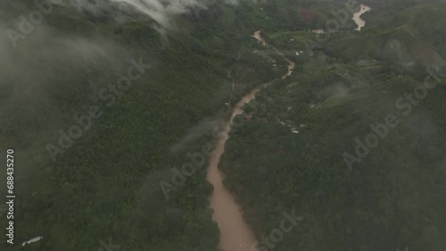 Flying through clouds at Semuc champey the Cahabon river Guatemala, aerial photo