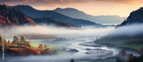 Autumn valley mist with colorful landscape.