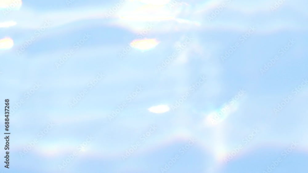 Blue abstract smooth bokeh light leak, water blurred motion, sunlight lens flare