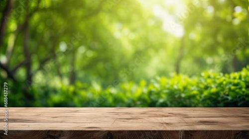 Empty old wooden table with green nature background