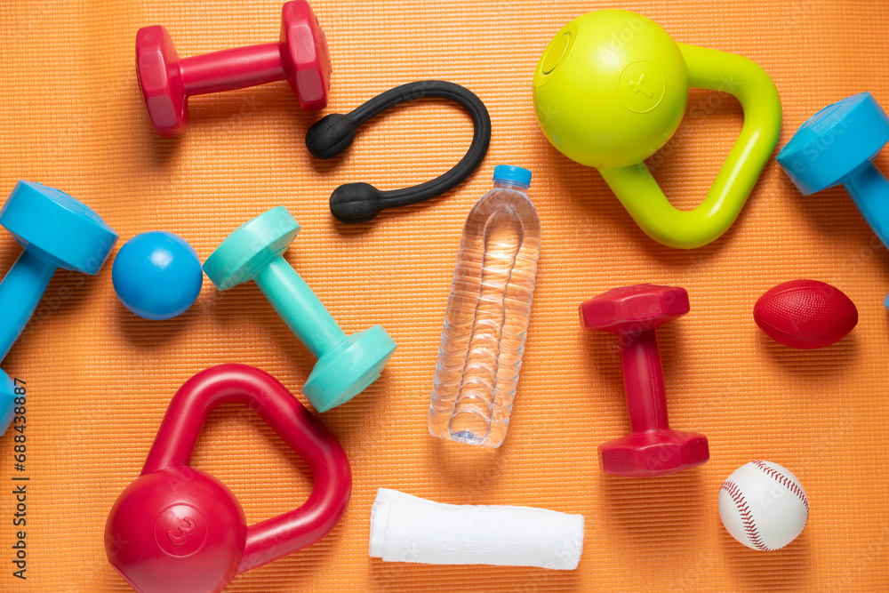 Time for exercising sport equipment on the yoga mat background, healthy and workout concept Time for exercising sport equipment on the yoga mat background, healthy and workout concept