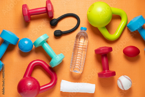 Time for exercising sport equipment on the yoga mat background, healthy and workout concept
