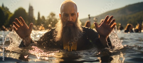 Fotografija Orthodox church baptism with water and priest's ritual.