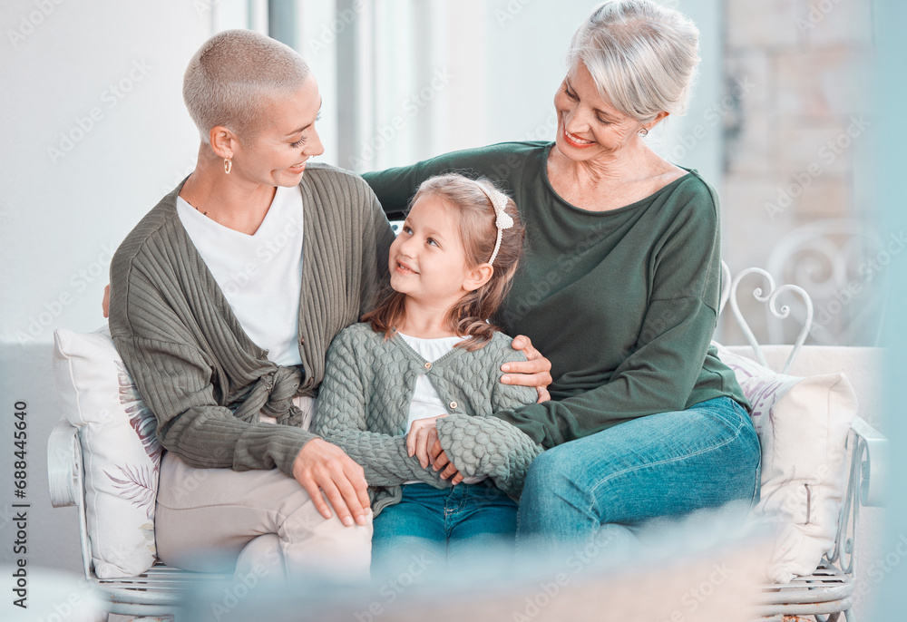 Mother, grandmother and girl with talk, sofa and hug for care, bonding or love in family home lounge. Elderly lady, kid and mom for embrace with smile, relax or together on living room couch in house