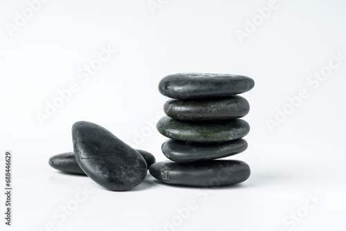 Stacked spa stones isolated on white background