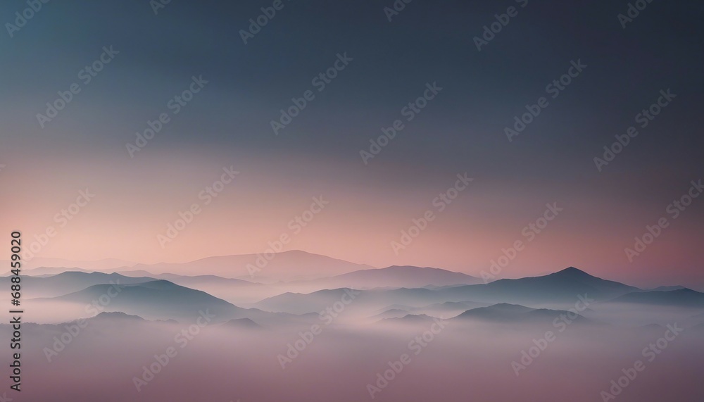 Mountain range in the fog at sunrise. Beautiful natural landscape.