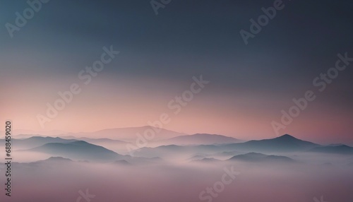 Mountain range in the fog at sunrise. Beautiful natural landscape.