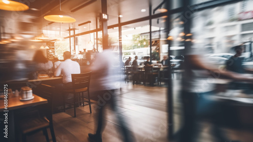 Blurred customers walking fast movement in coffee shop light cream  Blurred restaurant background
