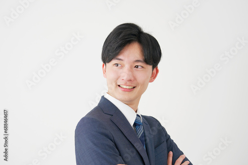20代の笑顔のビジネスマンのポートレート　白背景 photo