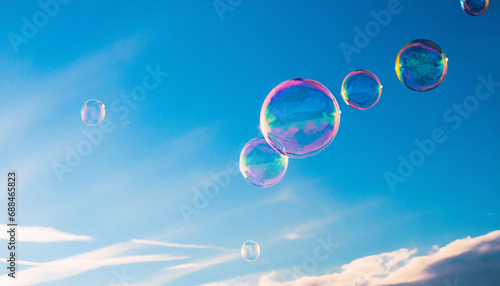 Soap bubbles flying in the sky © NizuCaCi