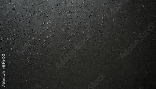raindrops on a black wall photo