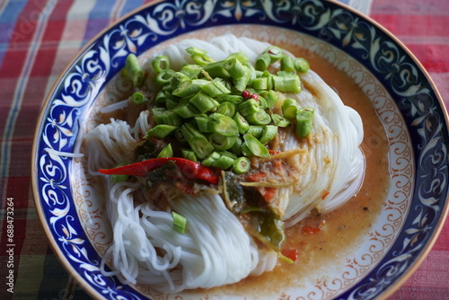 Khanomjeen namyapa , Rice vermicelli with clear minced fishes curry , Thai food. photo