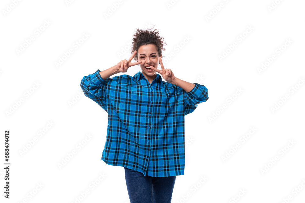 portrait of a slender young brunette woman in a loose-fitting blue plaid shirt portrait of a slender young brunette woman in a loose-fitting blue plaid shirt