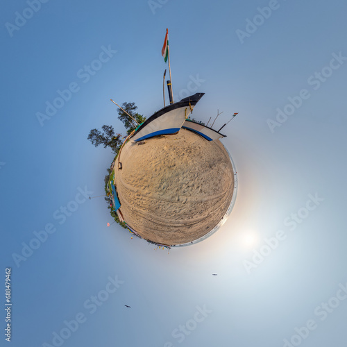 coconut trees in jungle in Indian tropic village on sea shore with fisher boat on little planet in evening sky, transformation of spherical 360 panorama.