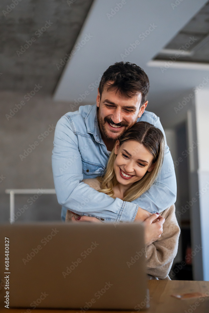 Young happy couple having video call online, conversation with relatives, communicating with friends Young happy couple having video call online, conversation with relatives, communicating with friends