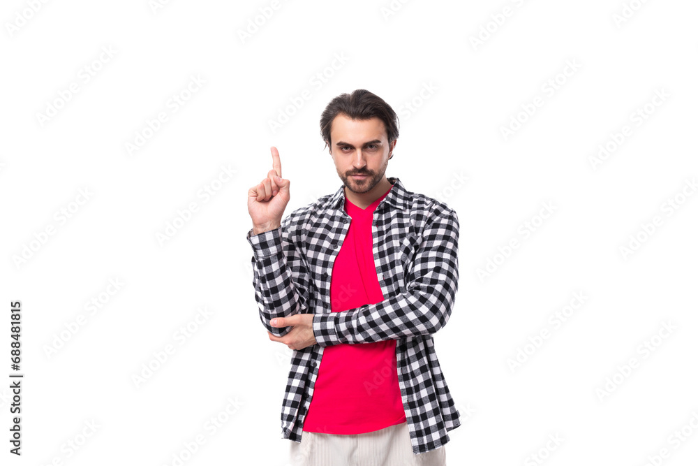young smart brunette caucasian man with a beard in a plaid shirt on a white background young smart brunette caucasian man with a beard in a plaid shirt on a white background