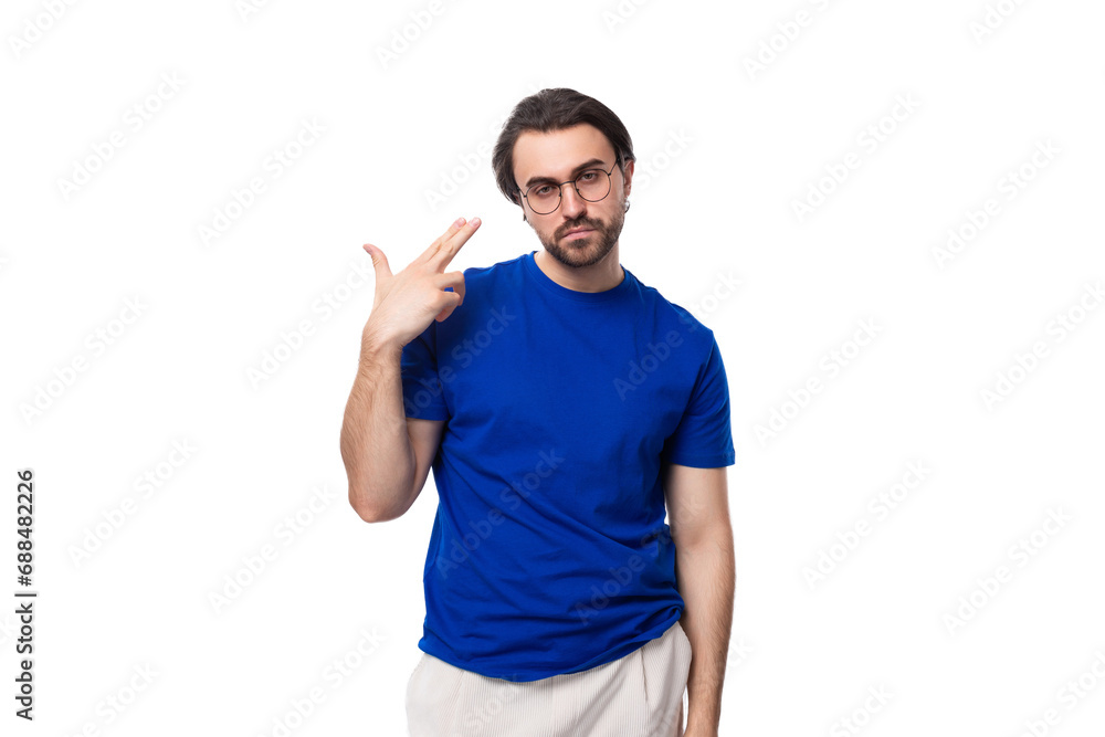 young smart confident caucasian brunette man with a beard in a blue t-shirt on a white background young smart confident caucasian brunette man with a beard in a blue t-shirt on a white background
