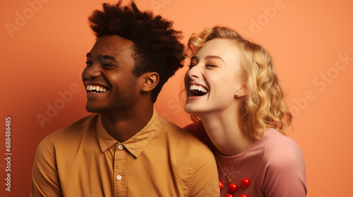 Cheerful african american man and european woman on color background. young multiracial couple. interracial family.