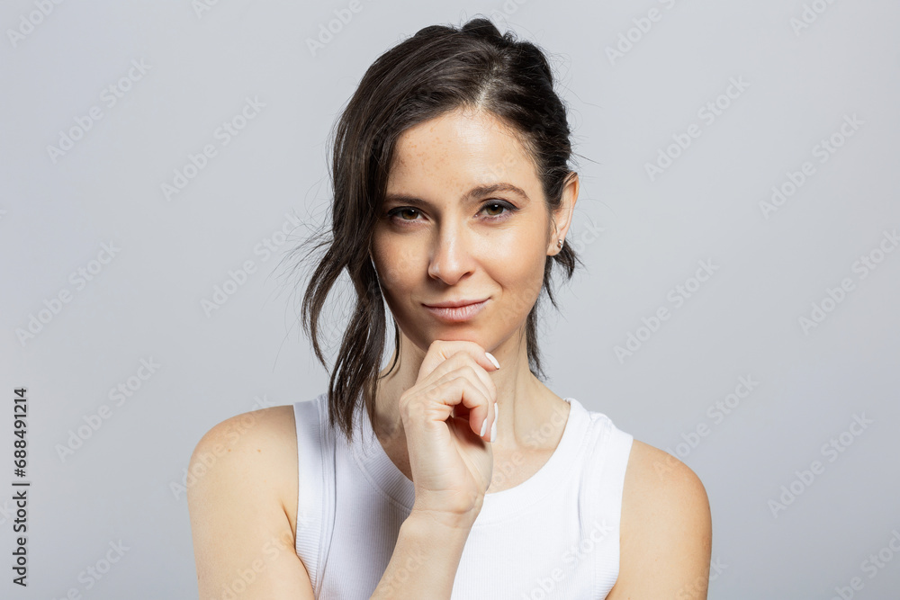 Portrait of an attractive young woman, studio shot Portrait of an attractive young woman, studio shot