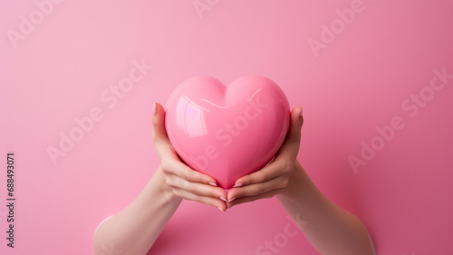 Heart in hands on a minimal background. Charity, health, care, love concept.