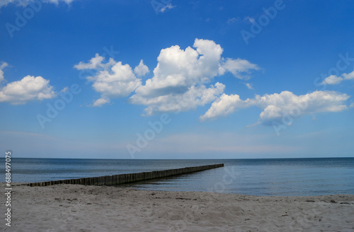 Wooden groynes in the calm Baltic Sea © kasparart