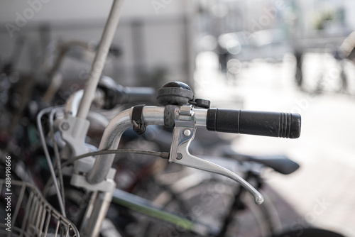 The classic style bike or bicycle vehicle, close-up at the handlebar part. Transportation vehicle object photo, selective focus.
