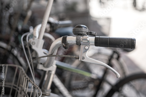 The classic style bike or bicycle vehicle, close-up at the handlebar part. Transportation vehicle object photo, selective focus.