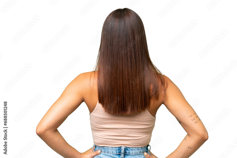 Young caucasian woman isolated on green chroma background in back position Young caucasian woman isolated on green chroma background in back position