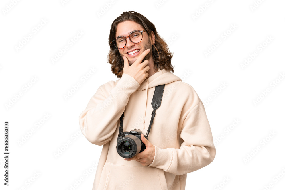 Young photographer man over isolated background smiling Young photographer man over isolated background smiling