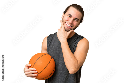 Young basketball player man over isolated background happy and smiling © luismolinero