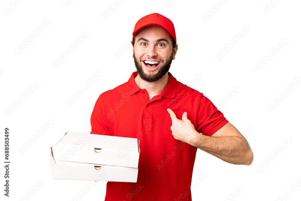 pizza delivery man with work uniform picking up pizza boxes over isolated chroma key background with surprise facial expression pizza delivery man with work uniform picking up pizza boxes over isolated chroma key background with surprise facial expression