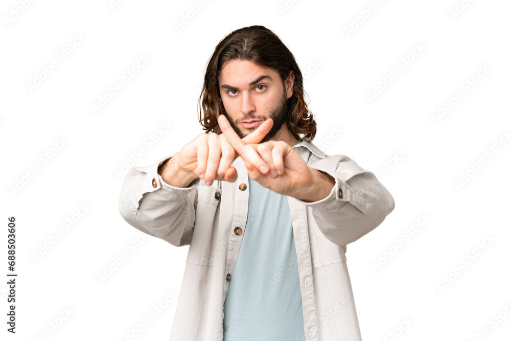Young handsome man over isolated chroma key background making stop gesture with her hand to stop an act Young handsome man over isolated chroma key background making stop gesture with her hand to stop an act