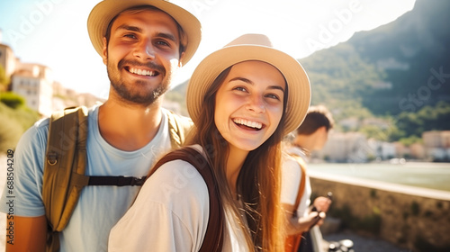 Holidays in Europe. Young woman and man wearing hats and backpacks walking the European streets. Traveling, Europe trip, holidays tour, vacation. Tourists exploring new city
