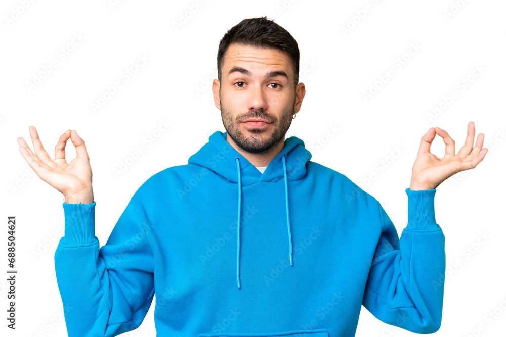 Young handsome caucasian man over isolated chroma key background in zen pose Young handsome caucasian man over isolated chroma key background in zen pose