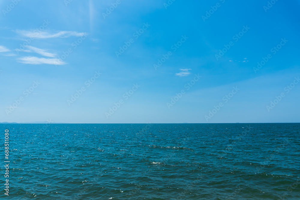 Fototapeta premium Bright blue sky with white clouds for background or wallpapers.The beauty of tropical nature, Chanthaburi province, Thailand, horizon, seascape, sea connect to the sky