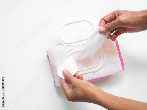 Wet Wipes Hand woman holding Tissue Paper Mokcup Wipe for Cean Hygiene Hand and wipe Cosmetic Beauty on Face, Baby, Packet in Toilet. photo