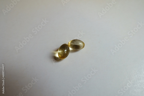 Pair of softgel capsules of vitamin D
